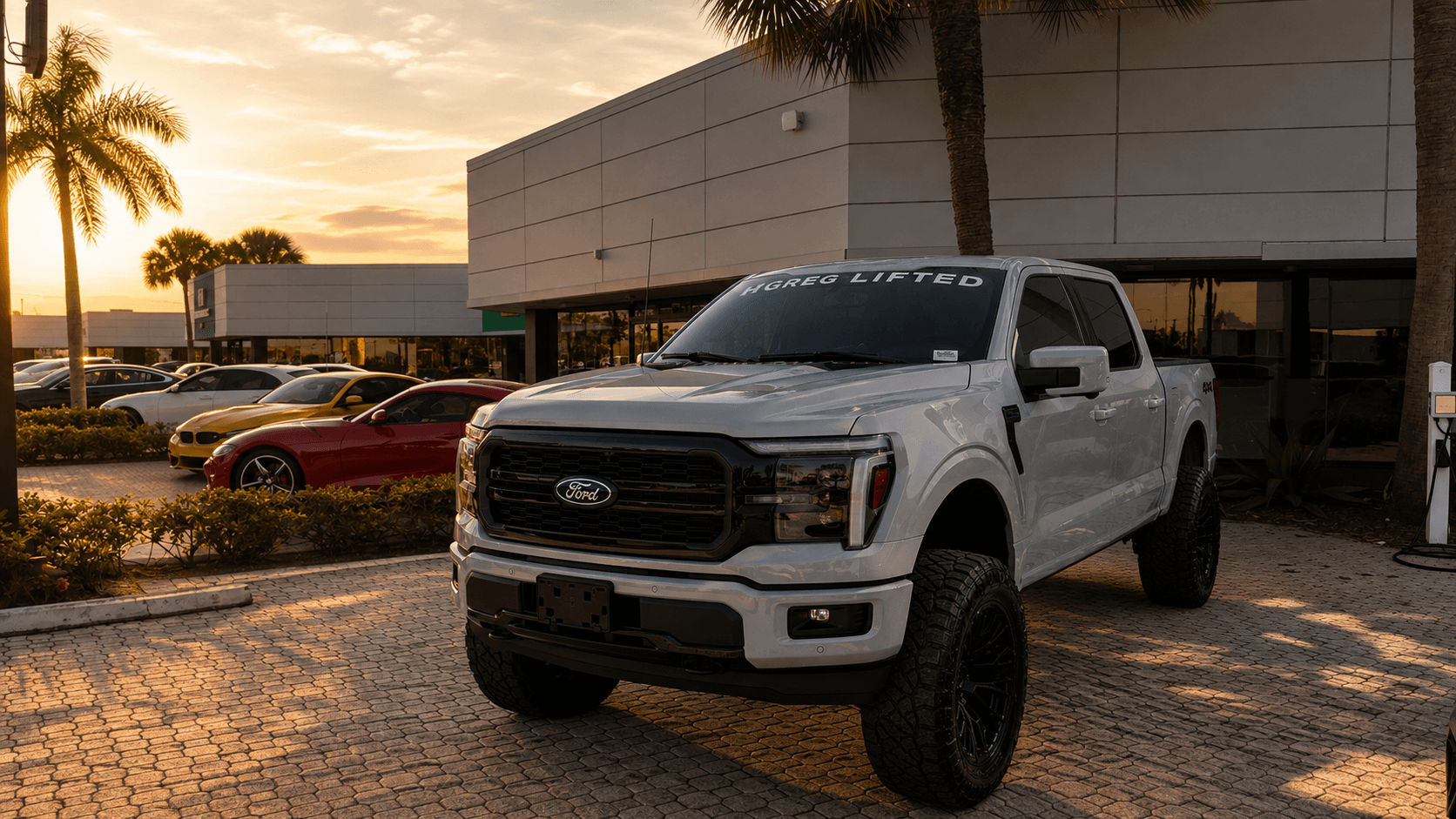 Completed HGreg Lifted Ford F-150 build outside the West Palm Beach dealership at sunset